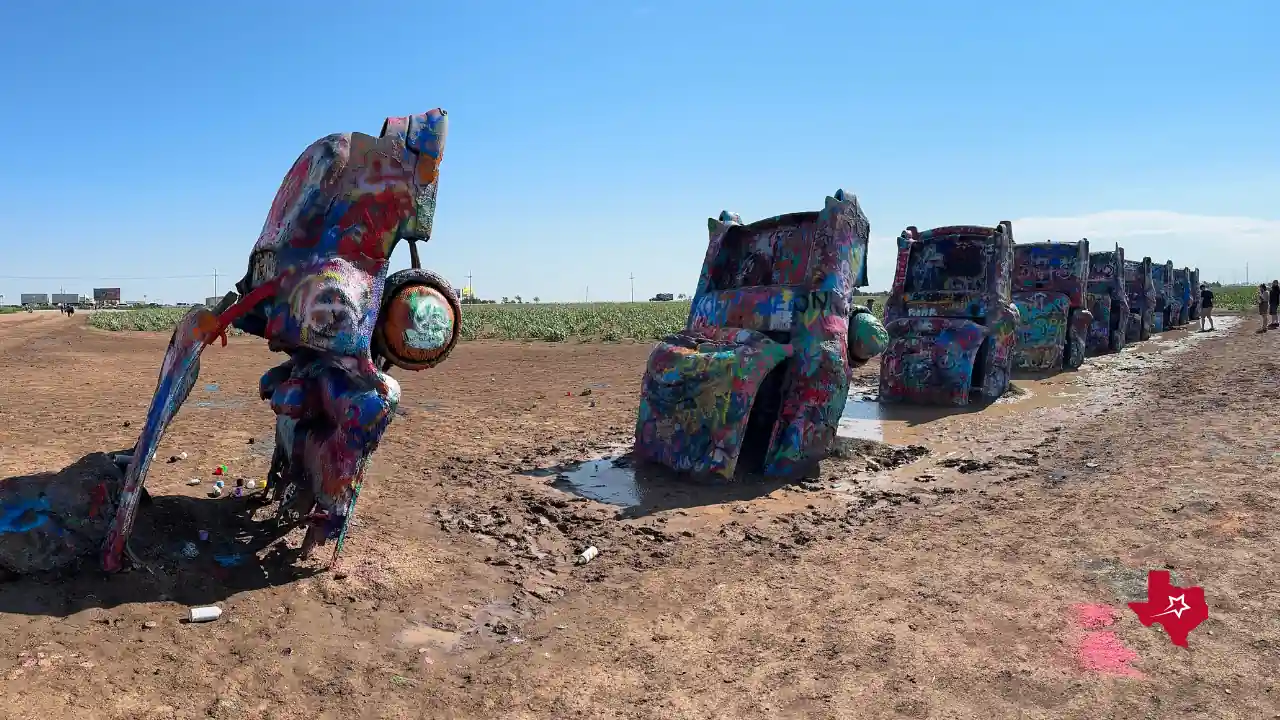 Close Up Cadillac Ranch towards parking on street