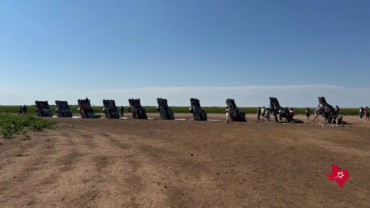 Wide shot of the Cadillac Ranch cars from the dirt road